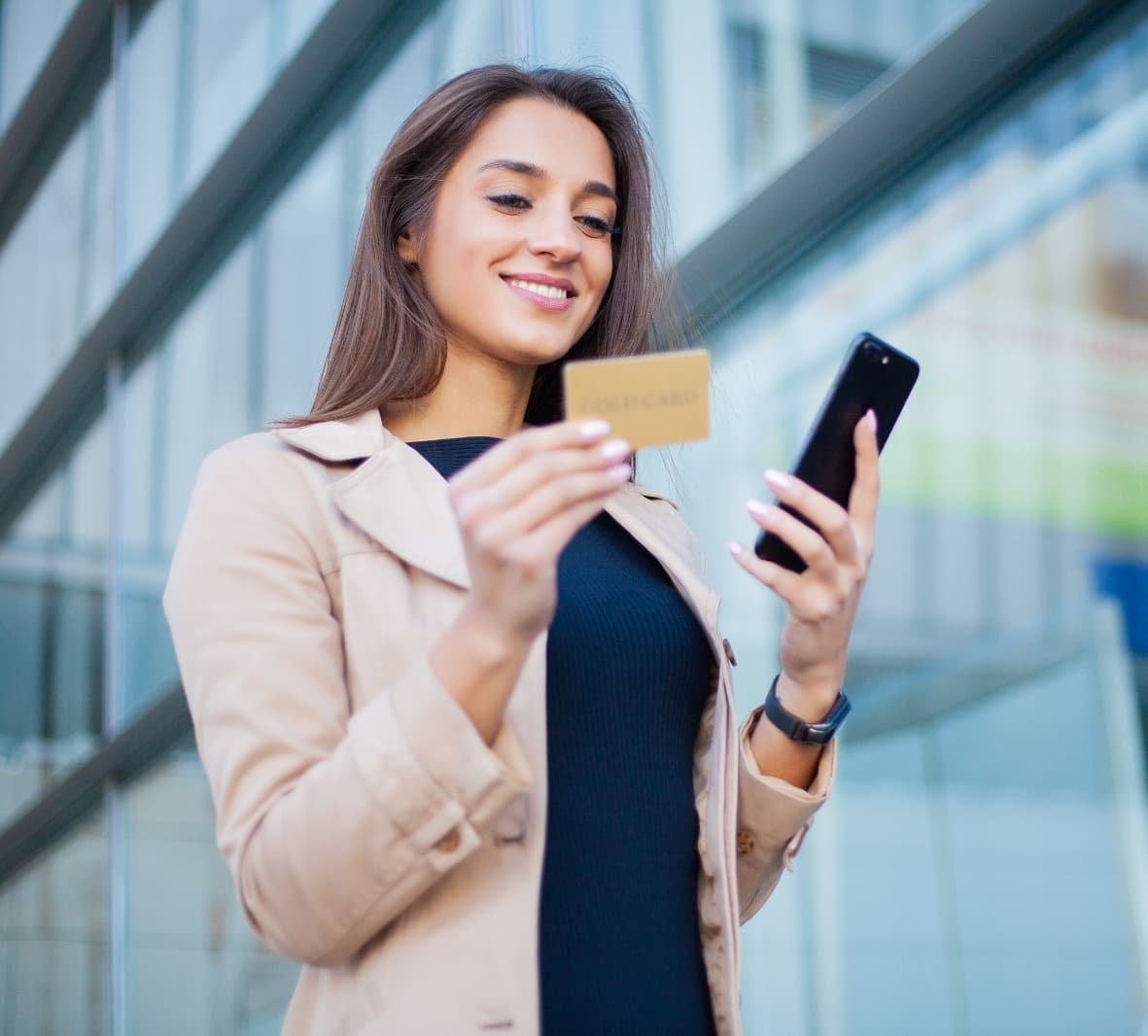 Woman using a gold credit card